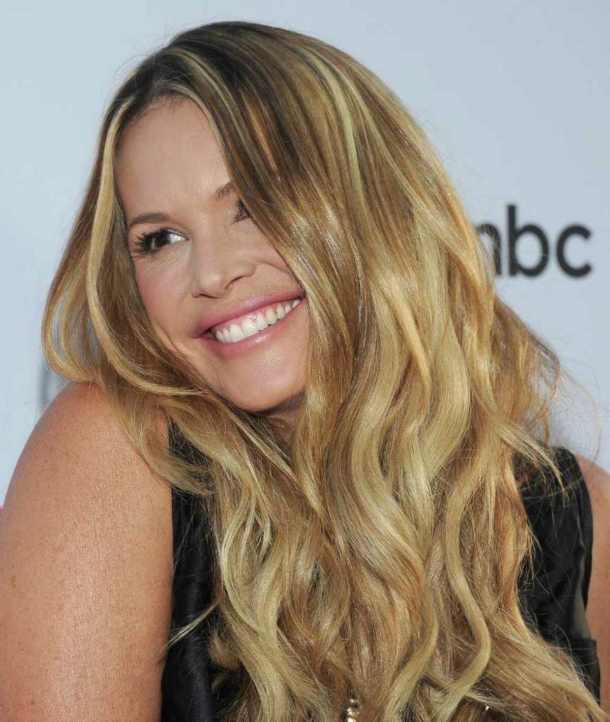  Actress Elle MacPherson arrives at the NBC Universal TCA 2011 Press Tour All-Star Party at the SLS Hotel in Los Angeles, California.