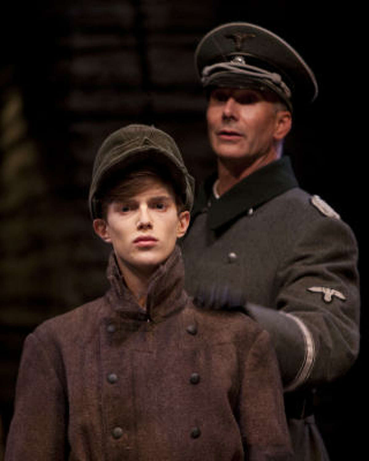 Devout young Nazi Finn Frey (Steven Louis Kane, left) gets his marching orders from Commandant Pister (Todd Waite) in the Alley Theatre's world premiere of Kenneth Lin's Intelligence-Slave.