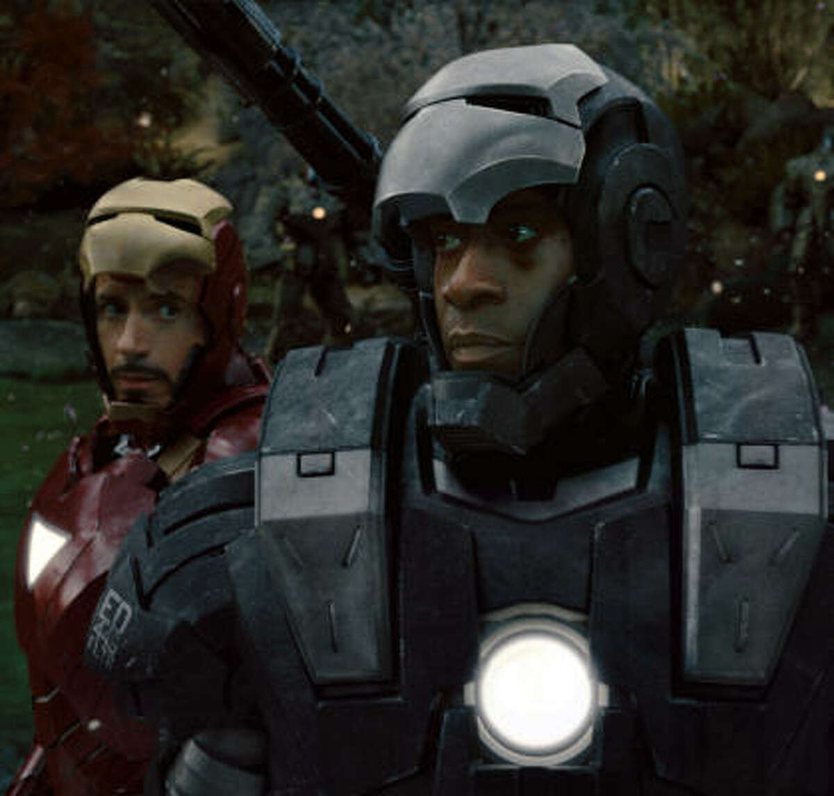 In Iron Man 2, Col. James “Rhodey” Rhodes, played by Don Cheadle, right, must balance his sense of duty to the military and his loyalty to friend Tony Stark (Robert Downey Jr.).