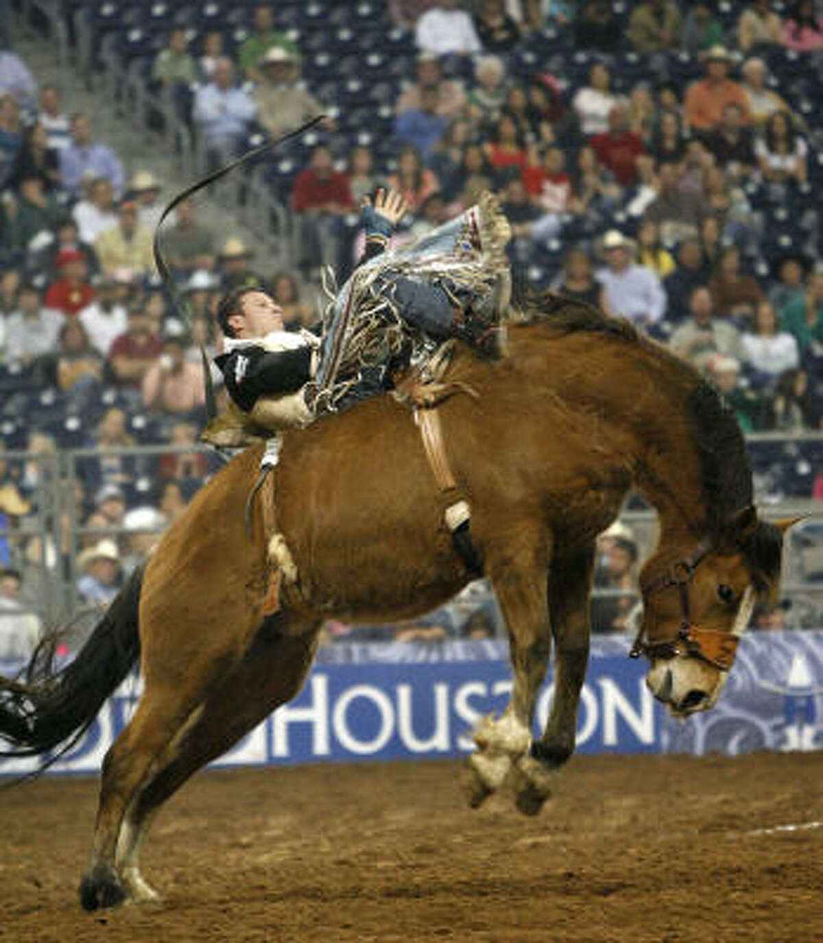 Clint Cannon rides Lonesome Blues for a score of 78.5 during the bareback competition Wednesday night.