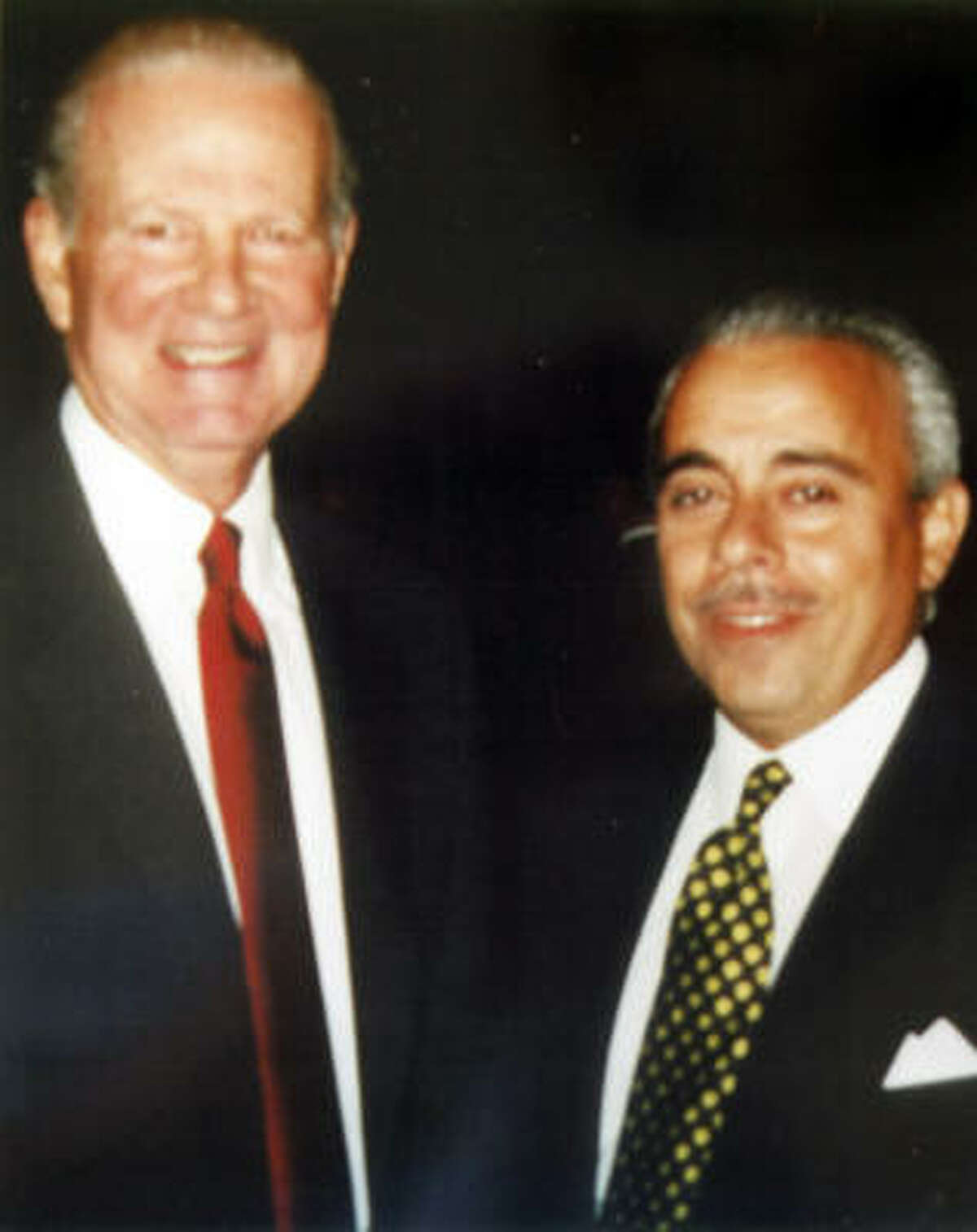 Vincent Carnaby, 52, is seen with former Secretary of State James Baker. Carnaby of Pearland held himself out as a federal intelligence agent but was sometimes reluctant to talk about his precise job and employer. At times he mentioned the Central Intelligence Agency or the Department of Homeland Security. He was the president of the local chapter of the Association for Intelligence Officers.