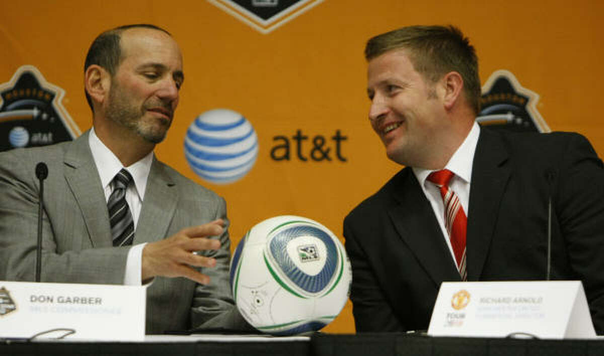 MLS commissioner Don Garber, left, and Manchester United's Richard Arnold anticipate an enthusiastic welcome for the game matching the MLS All-Stars and one of England's storied teams.