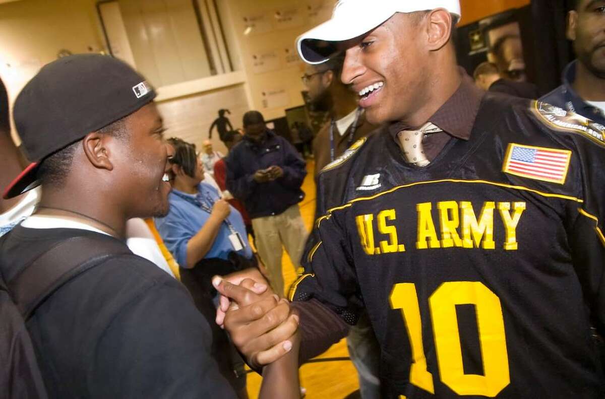 Khairi Fortt, of Stamford High School, greets a friend after announcing he will play football for Penn State next year during a rally and press event at Stamford High School in Stamford, Conn. on Monday, Oct. 5, 2009.