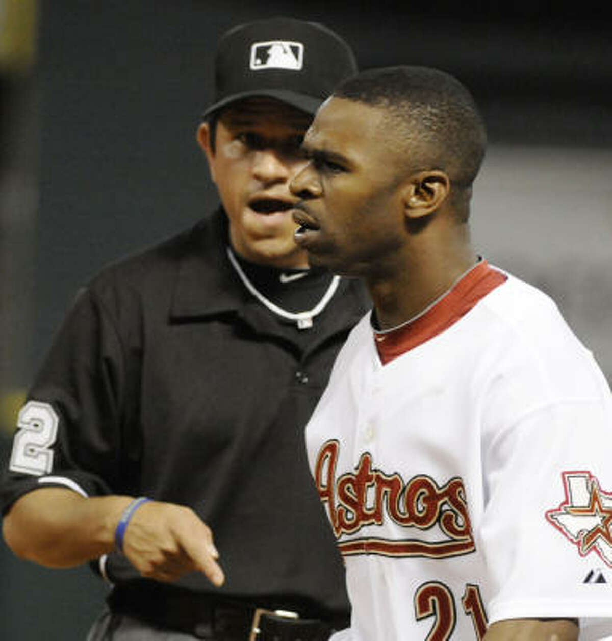 First-base umpire Alfonso Marquez, left, yells at Astros center fielder Michael Bourn before ejecting him in the ninth inning of Saturday's loss to the Padres.