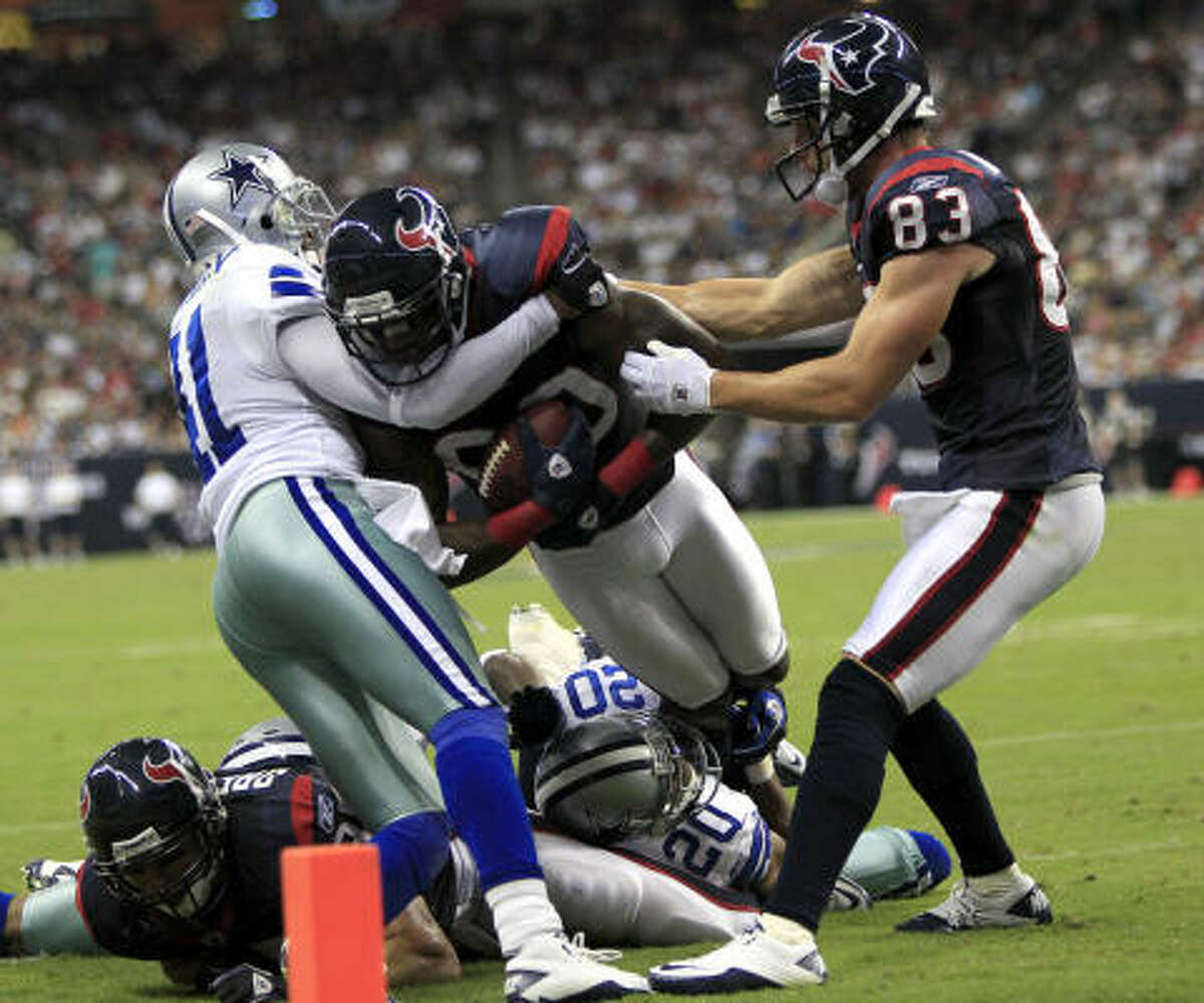 Texans wide receiver Andre Johnson fights for extra yardage in one play which displayed the team's toughness.