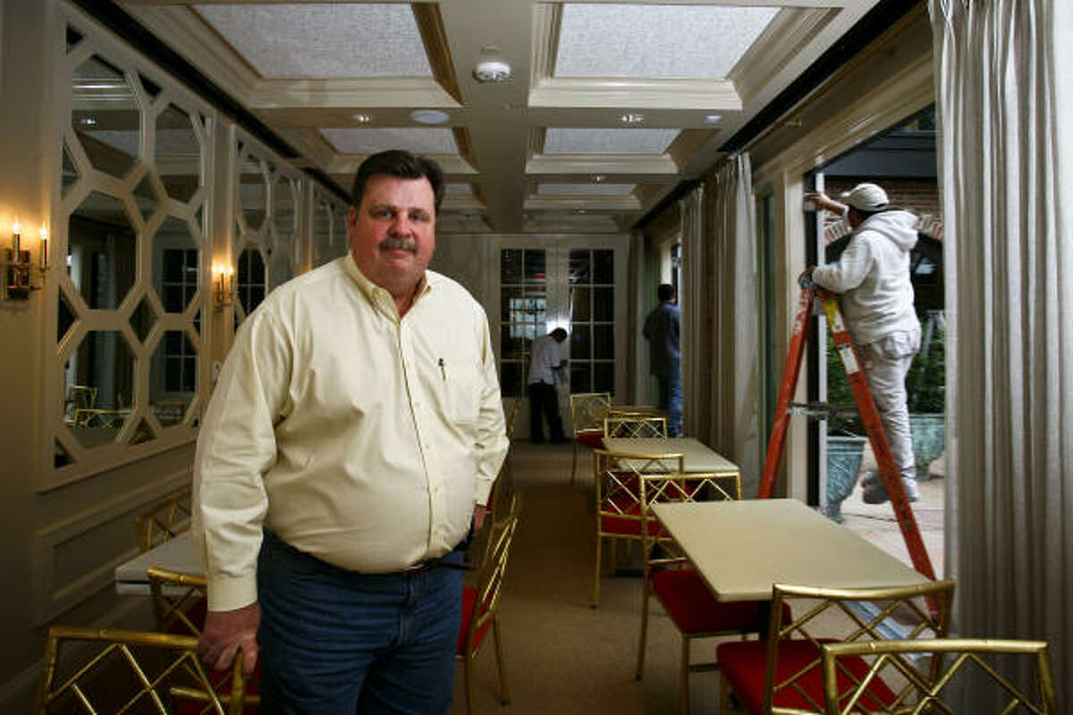 Alex Brennan-Martin, President of Brennan's of Houston, stands in one of the rebuilt dining rooms at Brennan's restaurant, which was nearly destroyed in September 2009 when a transformer fire caused by the whipping winds of Hurricane Ike engulfed the historic building in flames.