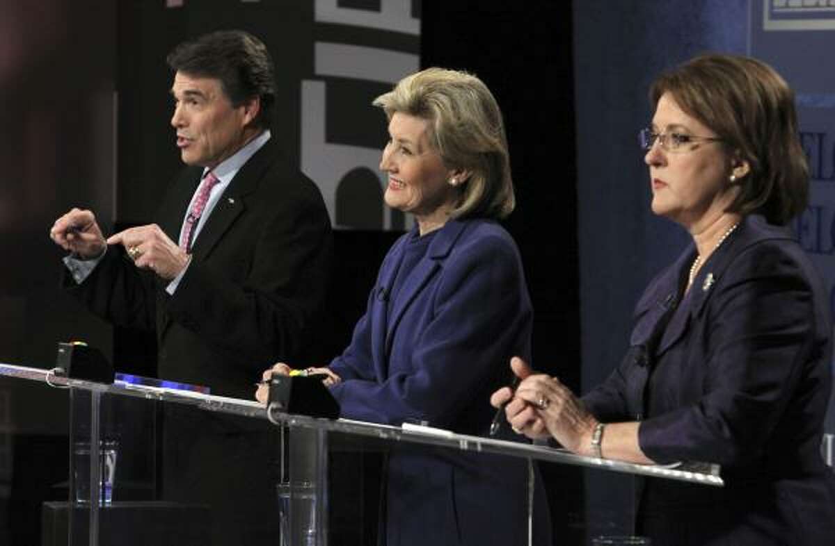 Gov. Rick Perry, U.S. Sen. Kay Bailey Hutchison, center, and Debra Medina face tough questions at a debate televised from Dallas on Friday.