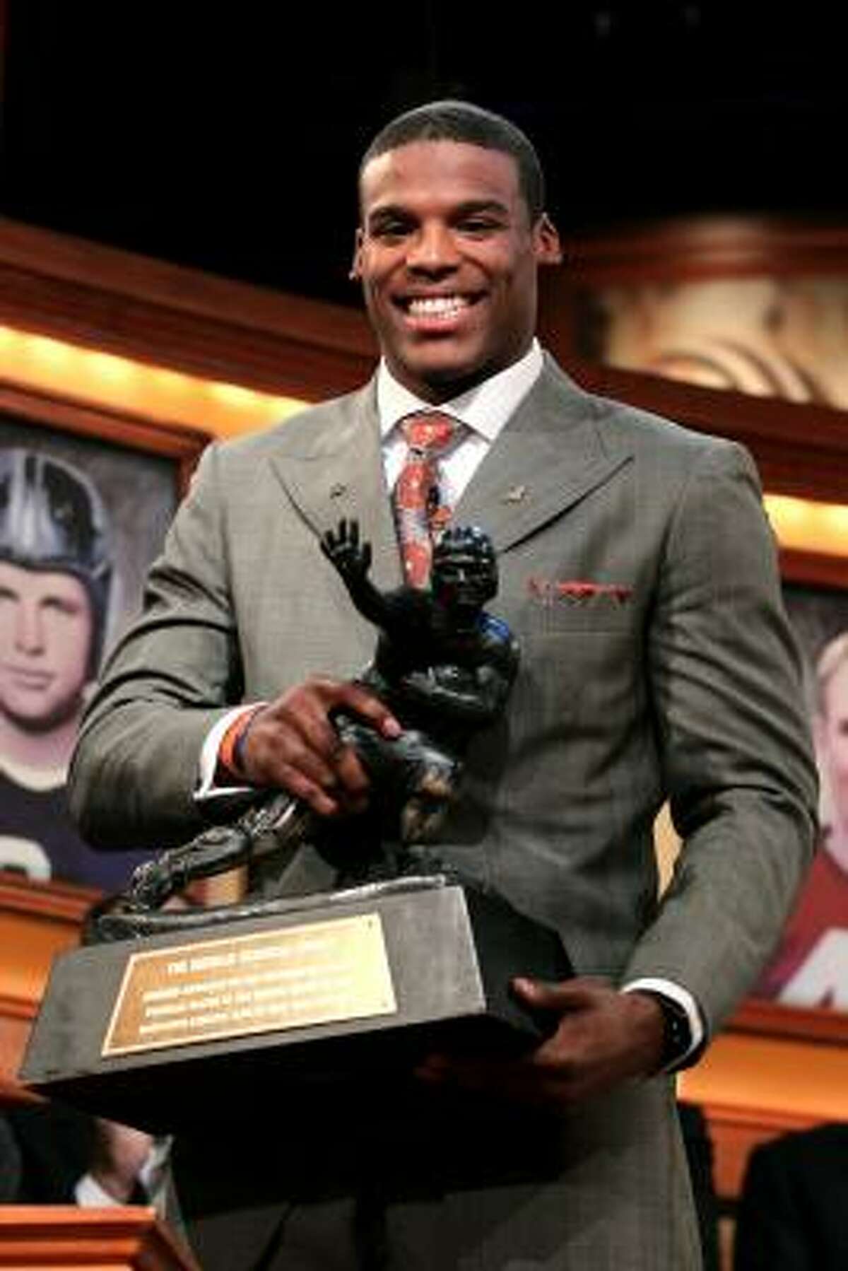 Auburn quarterback Cam Newton poses with the trophy after being named the 76th Heisman Memorial Trophy Award winner on Saturday night in New York City.