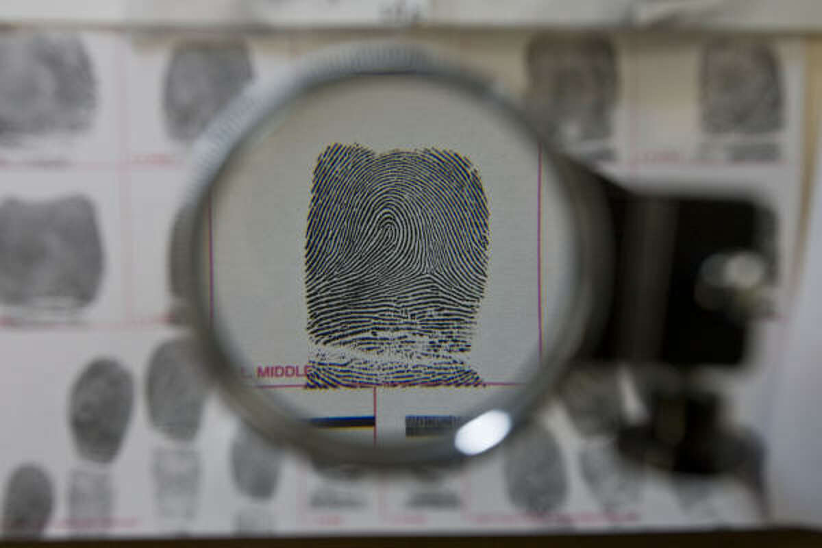 A ﻿sample ﻿at the ﻿HPD fingerprint unit is magnified.﻿ Thousands of cases from 2004 to 2009 have been reviewed.