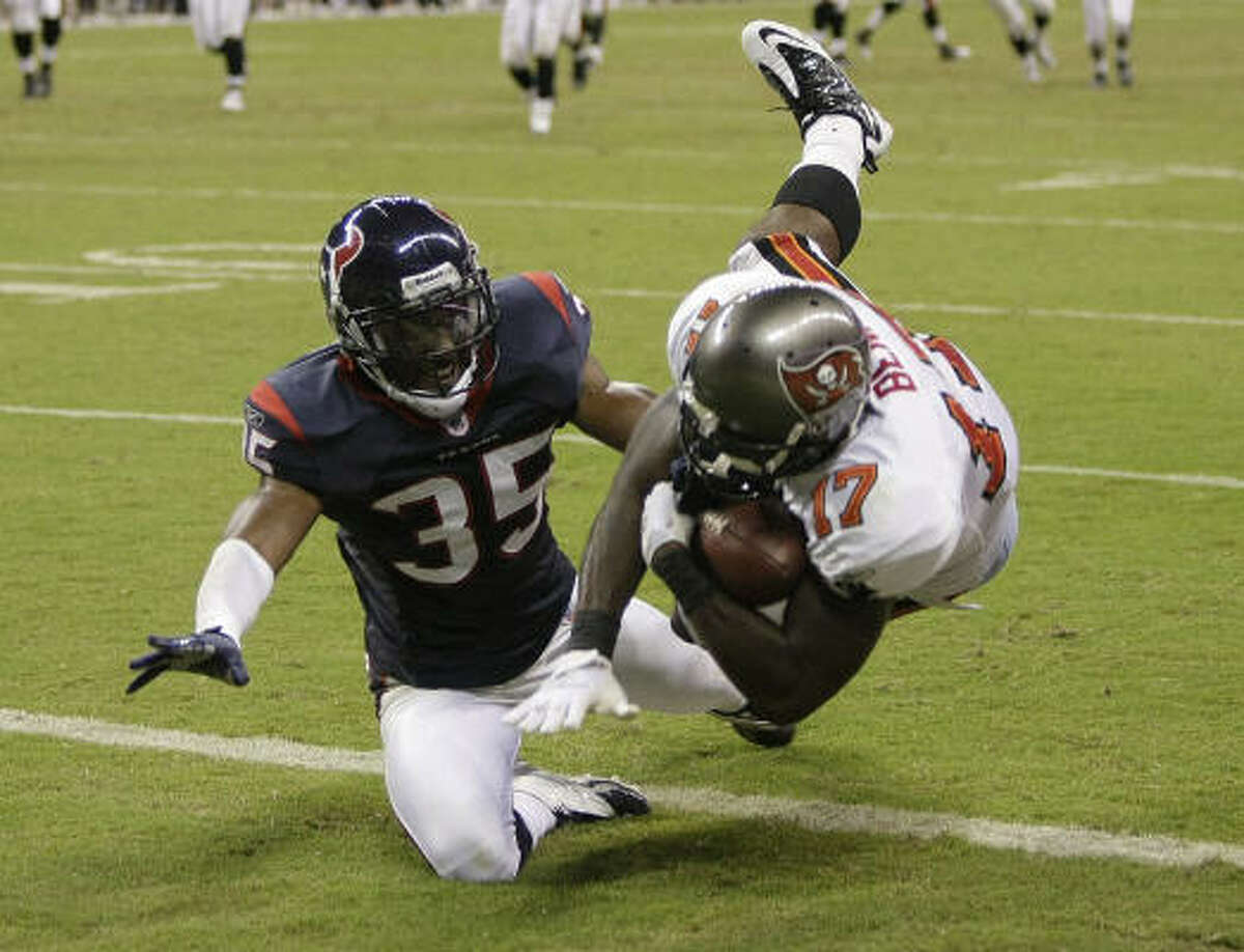 Buccaneers rookie wide receiver Arrelious Benn (17) beats Texans cornerback Jacques Reeves for a 21-yard touchdown reception Thursday at Reliant Stadium.