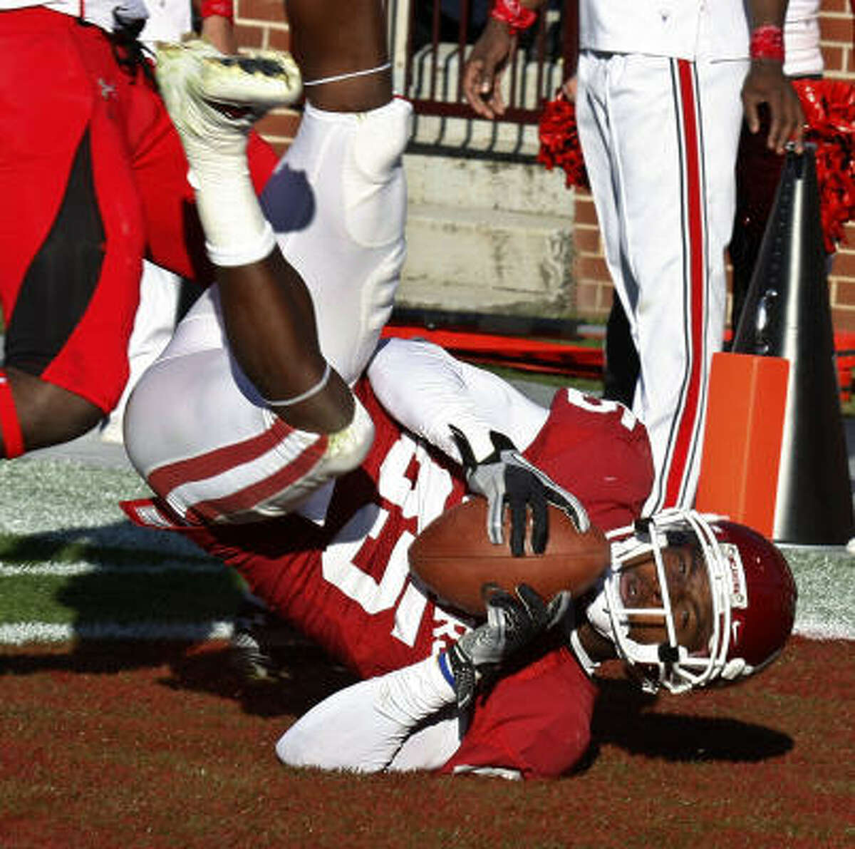Oklahoma wide receiver Ryan Broyles falls backwards into the end zone with a touchdown against Texas Tech in the second quarter on Saturday.