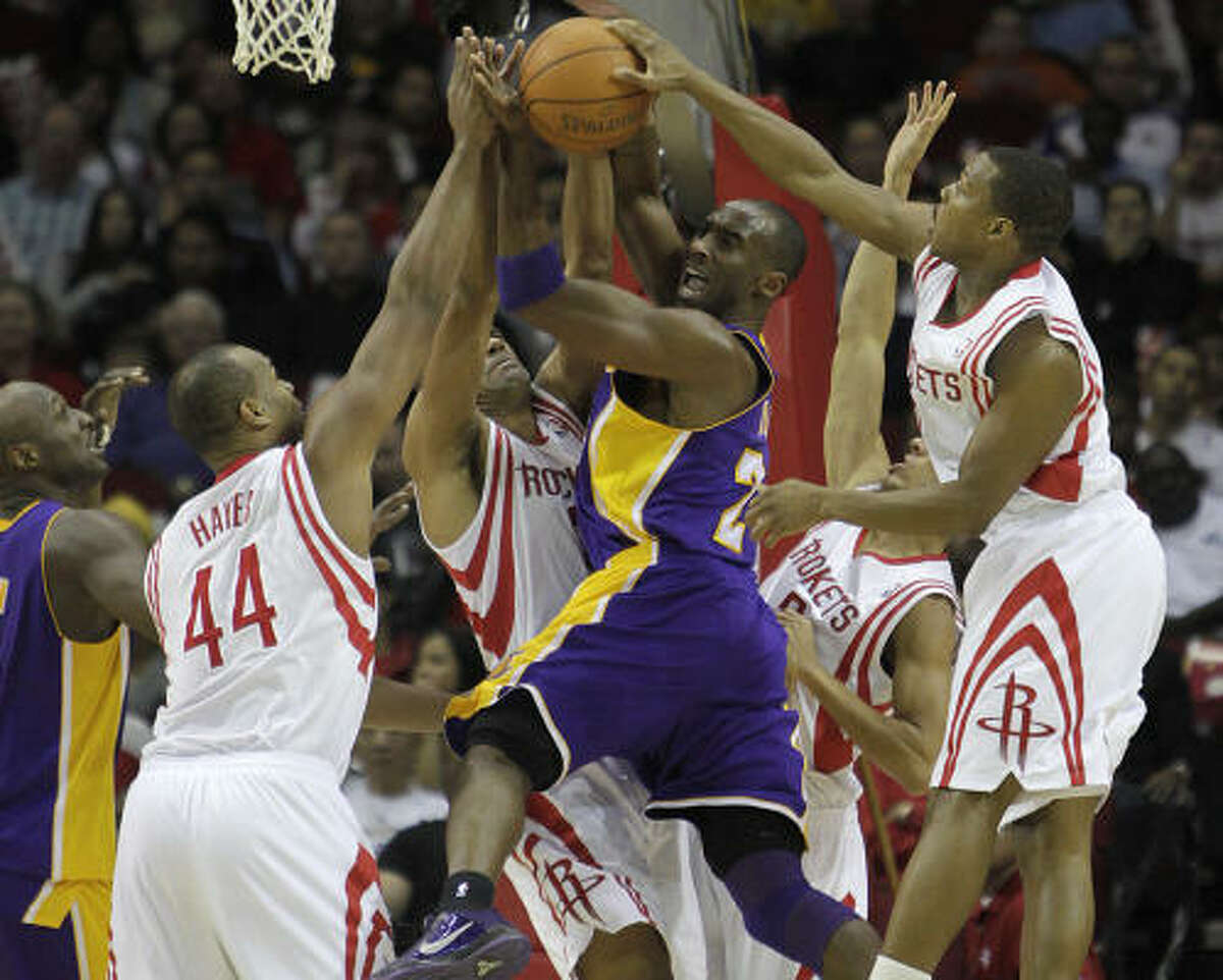 Dec. 1: Rockets 109, Lakers 99 Lakers guard Kobe Bryant gets stopped by a host of Rockets while on his way to the basket during the first half.