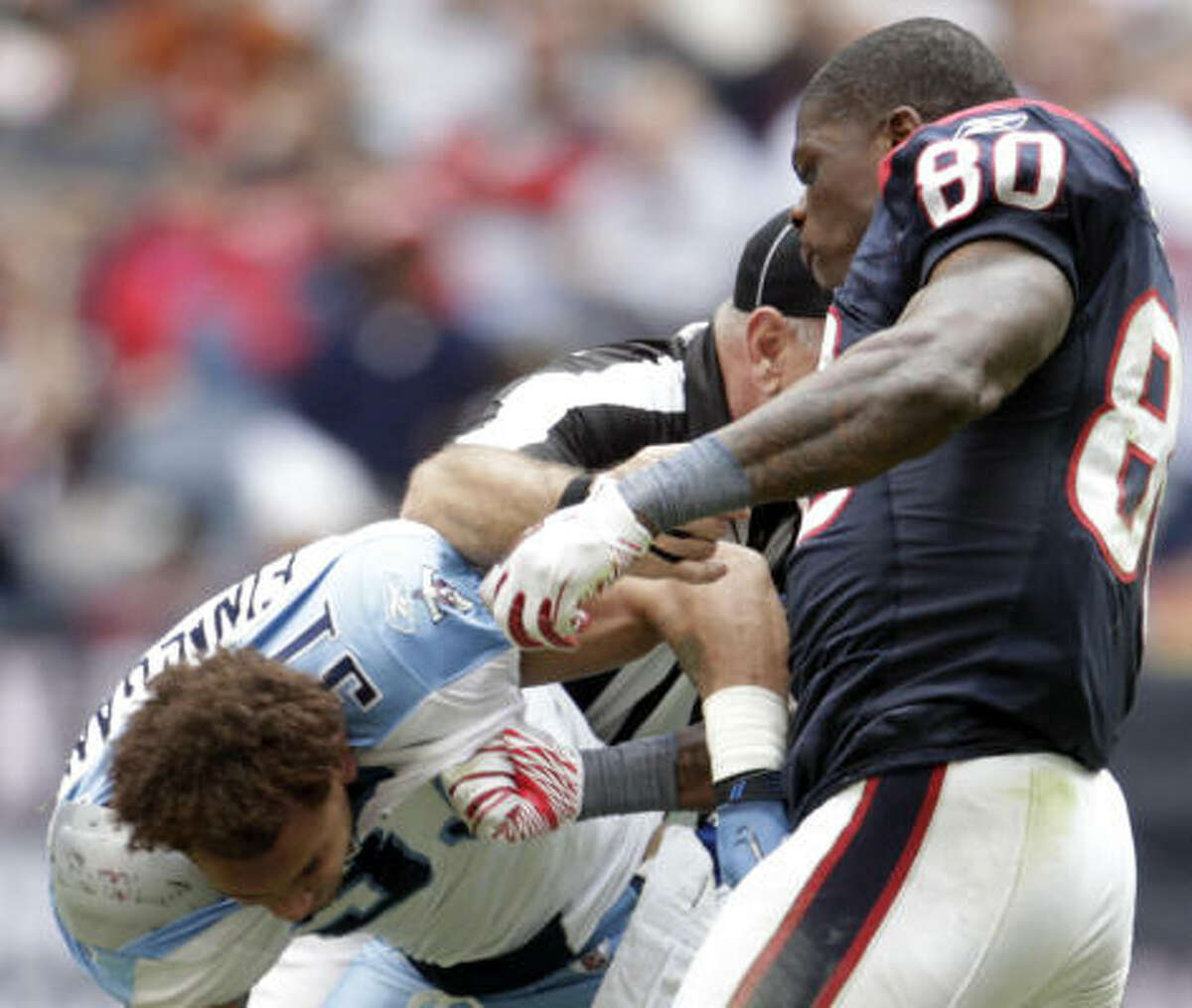 Nov. 28: Texans 20, Titans 0 Texans wide receiver Andre Johnson (80) fights with Titans cornerback Cortland Finnegan during the fourth quarter of Sunday's game at Reliant Stadium. The players ripped off each other's helmet and were ejected from the game.