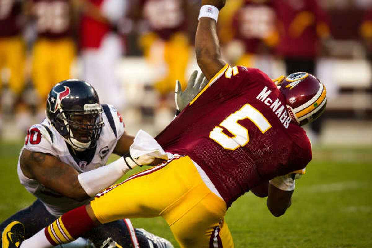 Texans defensive end Mario Williams sacks Redskins quarterback Donovan McNabb.