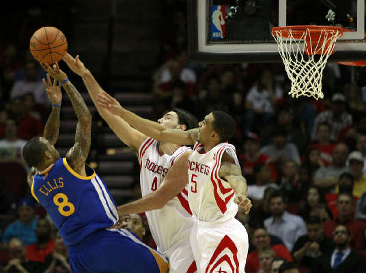 Nov. 24: Rockets 111, Warriors 101 Warriors guard Monta Ellis (8) goes up for a shot against the defense of Rockets forward Luis Scola (4) and guard Courtney Lee during the first half of Wednesday's game at Toyota Center.