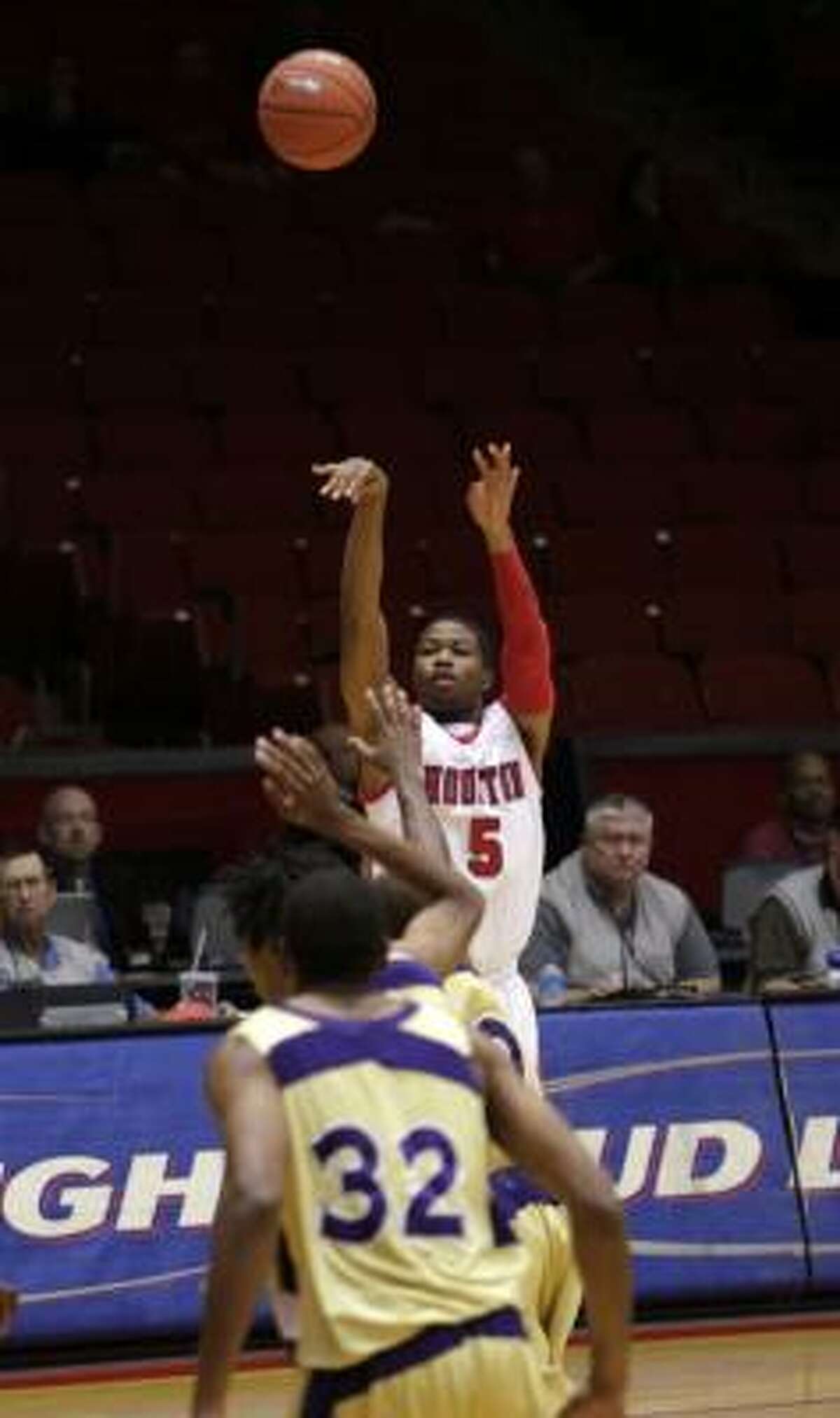 Houston's Nick Haywood (5) puts up a three-pointer against Alcorn State.