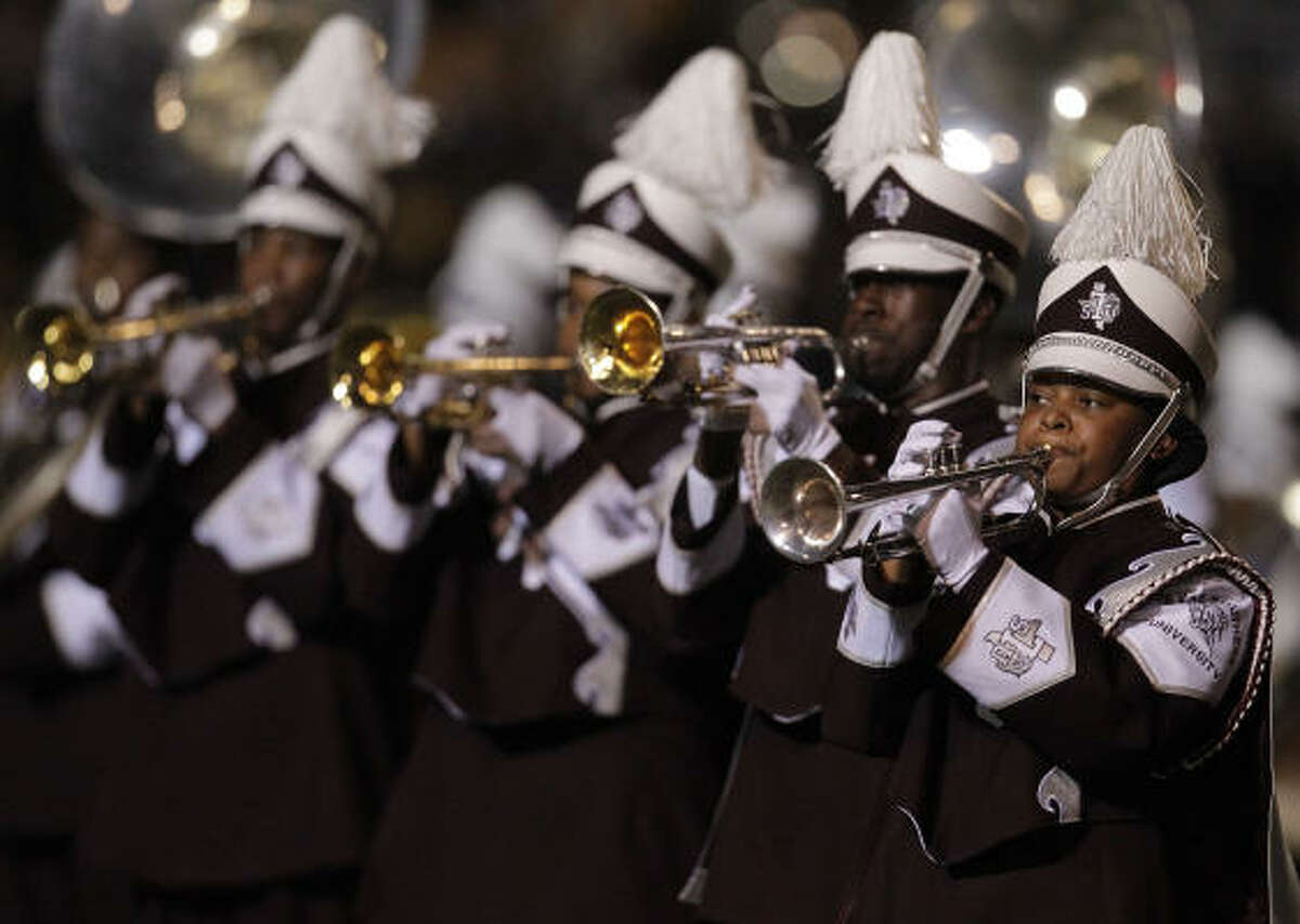 Members of the TSU band, The Ocean of Soul, perform on the field before the start of the game.