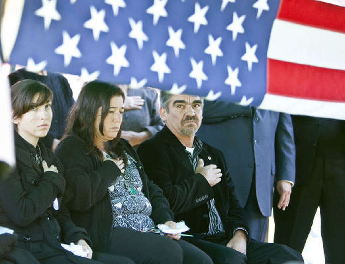 Funeral services were held Monday for Army Spc. Pedro Maldonado, who was killed in an attack on his unit in Kandalay, Afghanistan. From right are father Pedro Maldonado and his wife, Maria Maldonado; and the soldier's twin sister, Bianca Maldonado.