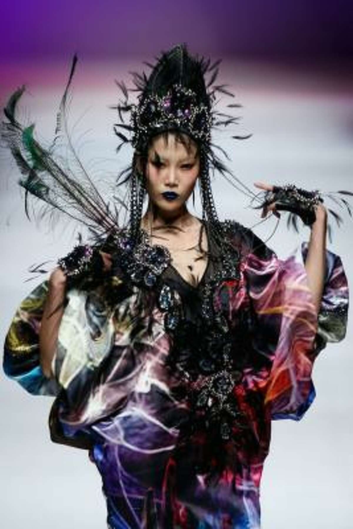 See, some would say black lace, features and a prismatic rainbow print would be too much. Designer Qi Gang apparently would not.