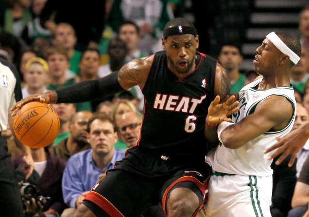 Heat forward LeBron James posts up Celtics forward Paul Pierce in the first quarter on Tuesday night.