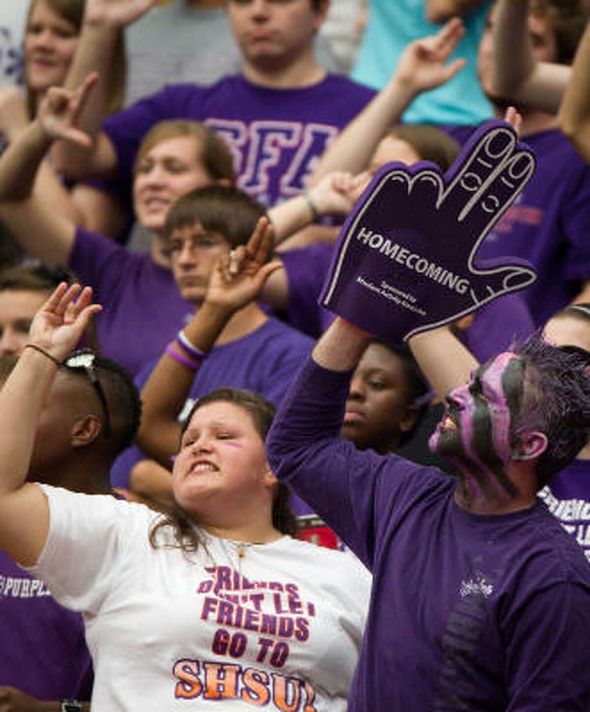 Stephen F. Austin fans celebrate after a 59-yard touchdown catch by wide receiver Cordell Roberson during the first half.
