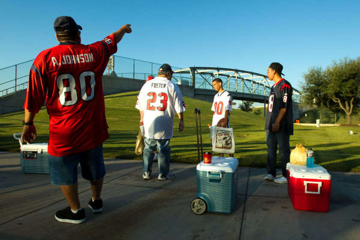 Fans tailgate prior to an NFL football game between the Houston