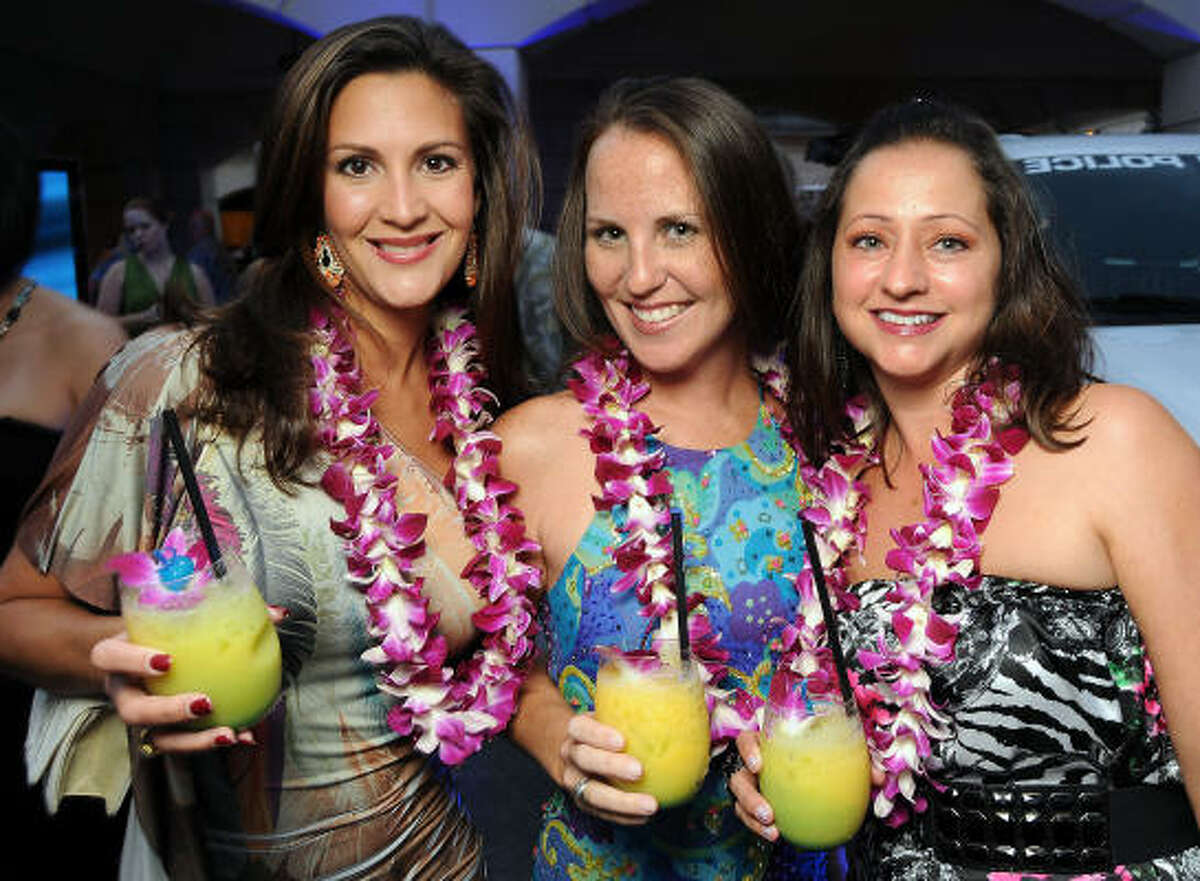 From left: Jessica Gumm, Amanda Burnett and Tracy Eads Posesta at the "Blue Hawaii" Houston Police Foundation 2010 Gala at the home of Paige and Tilman Fertitta.