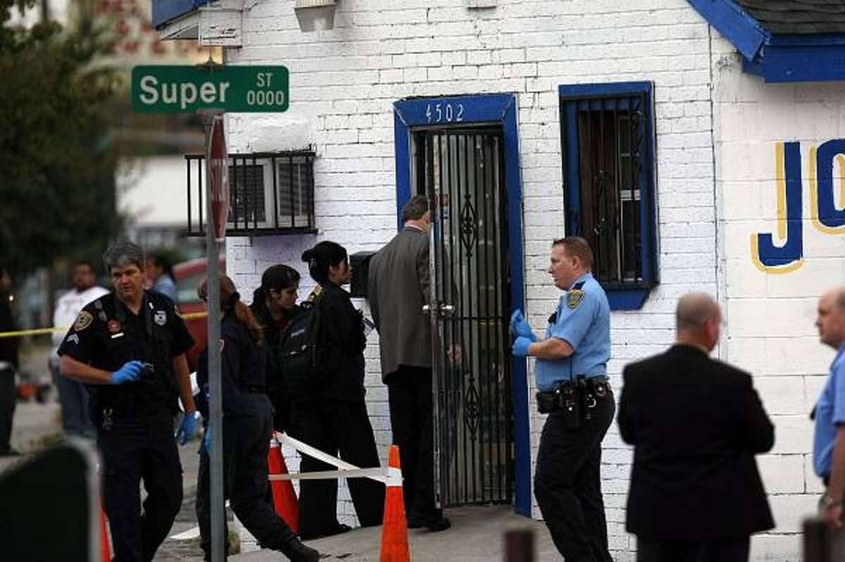 Houston police officers on Thursday investigate after the shooting at Castillo's Jewelry on Canal in the East End.