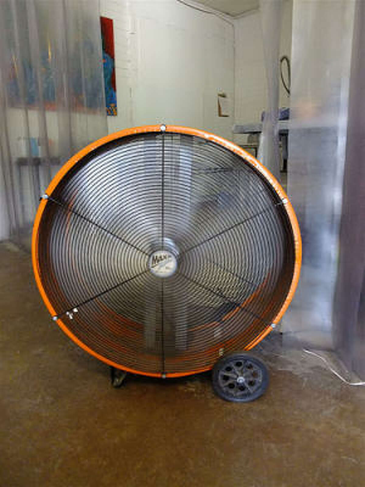 The Houston Dairymaids main warehouse space isn't air-conditioned, but a powerful industrial fan blasts visitors with cooling gusts. Iced-down beer & bottled water do the rest.