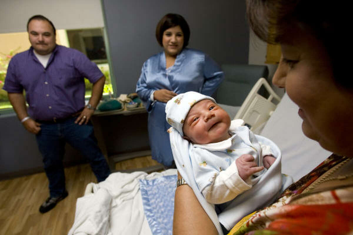 One-day-old, Gabrial Alejandro Vela, is held by his gradmother, Alicia Balderas, as his father, Salvador Vela Jr., 34, a pharmacy consultant, and mother, Alexandra Vela, 31, a small business owner, look on as they spend time with Gabrial at Woman's Hospital at Renaissance in McAllen. Woman's Hospital at Renaissance has assisted in delivering more than 23,000 babies since it opened in Oct. 2007. McAllen, the county seat in Hidalgo County, is a rapidly growing city of 130,000 with about 1,500 babies born each month in the greater metropolitan area. The county is young with a median age of 27. Just over 35 percent of the county's 750,000 people are under the age of 18.