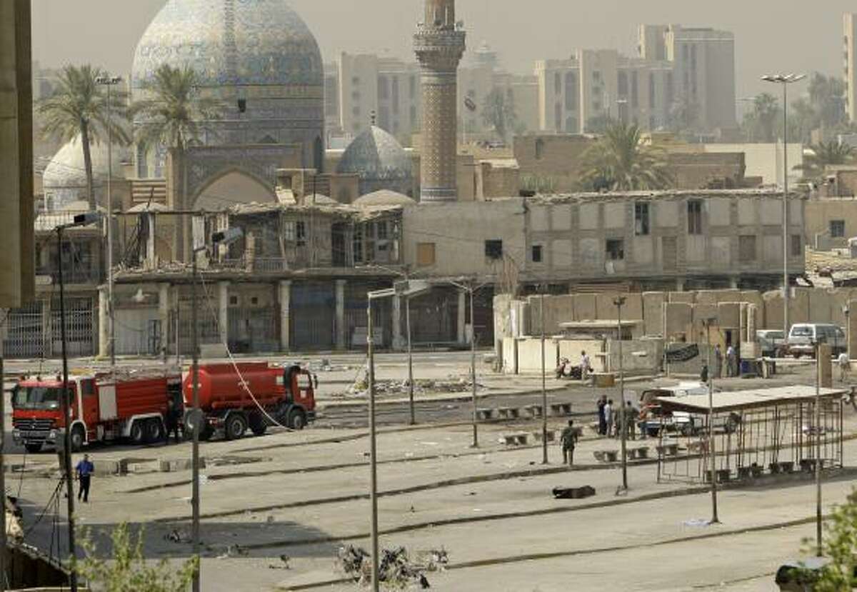 Iraqi security forces inspect the scene of a suicide attack in Baghdad, Iraq, Tuesday, Aug. 17, 2010. A suicide bomber blew himself up among hundreds of army recruits who had gathered near a military headquarters killing and wounding dozens of them, one of the bloodiest bombings in months in the Iraqi capital.