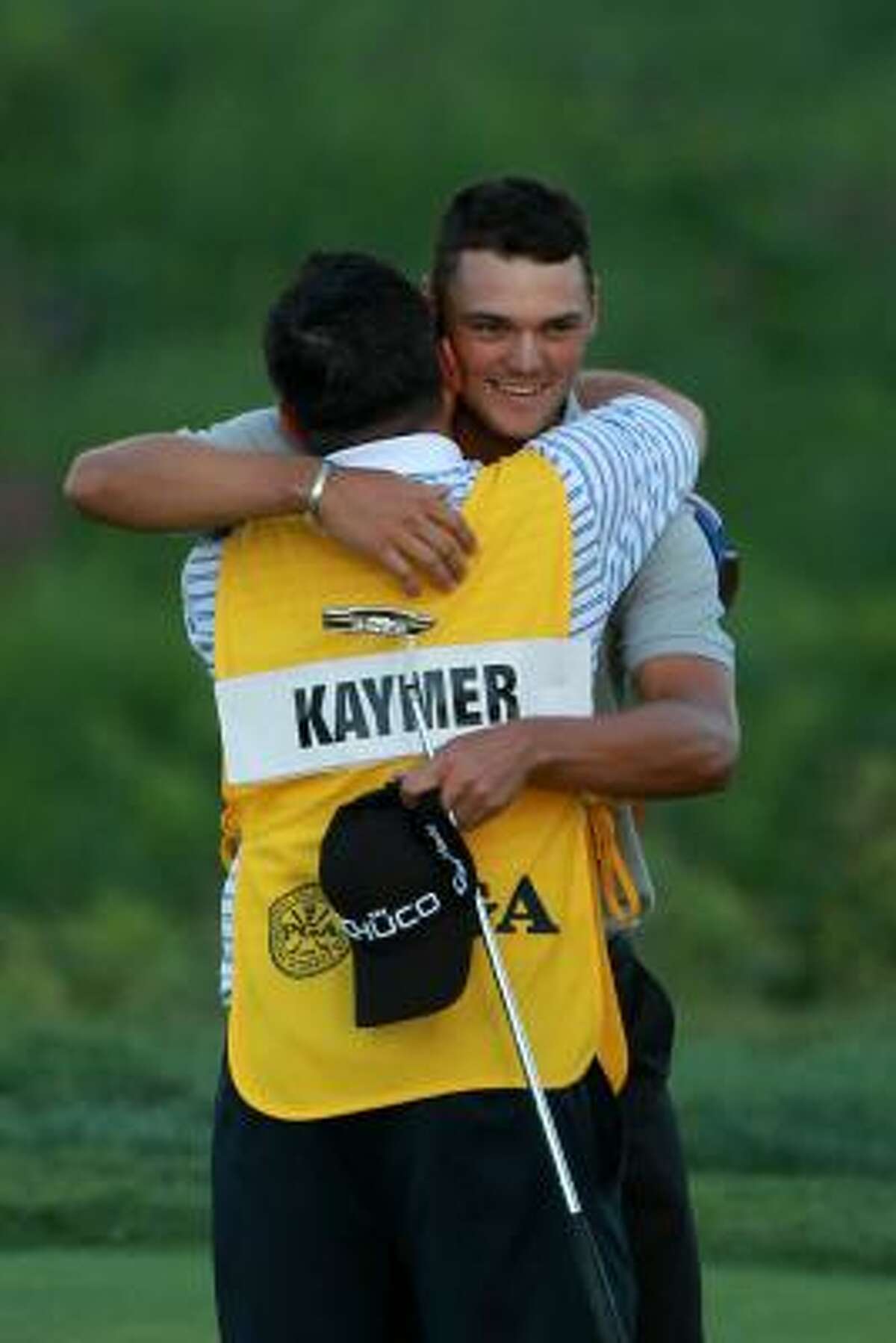 Martin Kaymer celebrates with his caddie, Craig Connelly, on the 18th green after winning the PGA Championship.