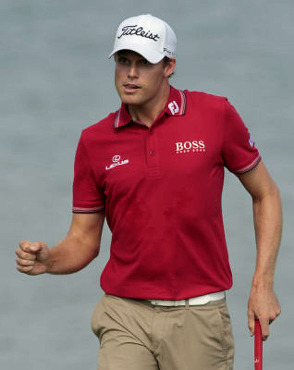 Nick Watney, who grabbed the lead early in the round, reacts after making a birdie putt on the seventh hole.