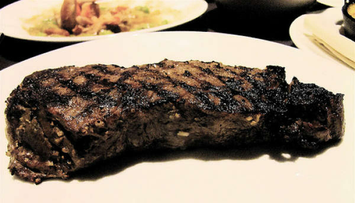 A 10-ounce USDA Prime NY strip steak at The Barbed Rose, one of the menu's revolving meat options. Beef, game, fish & fowl cuts of the evening are presented on a separate menu sheet.