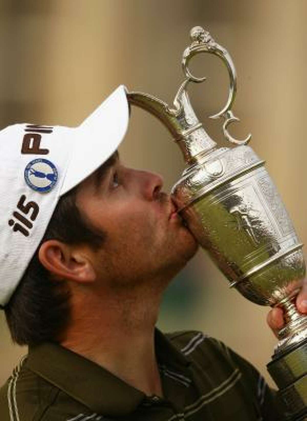 Louis Oosthuizen kisses the Claret Jug, given to the winner of the Open Championship.