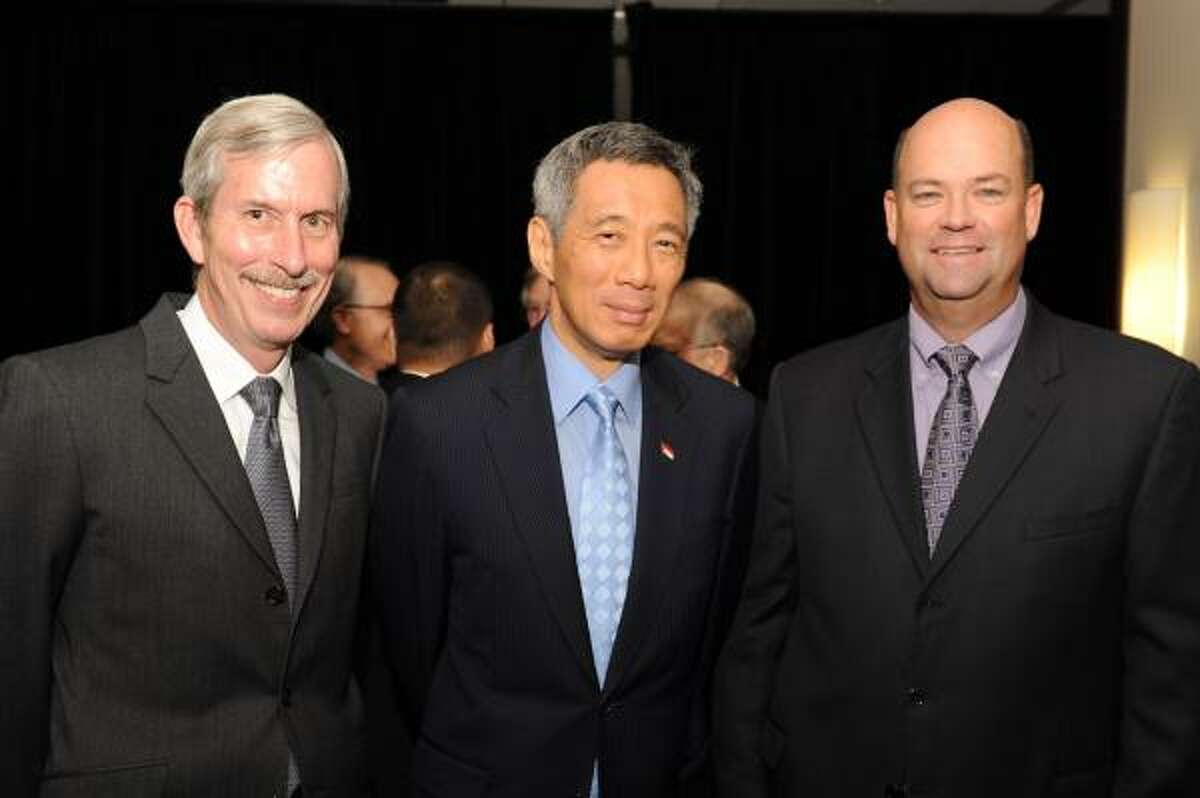 John Carrig, Singapore Prime Minister Lee Hsien Loong and Ryan Lance at a luncheon hosted by Asia Society Texas Center and the Greater Houston Partnership.