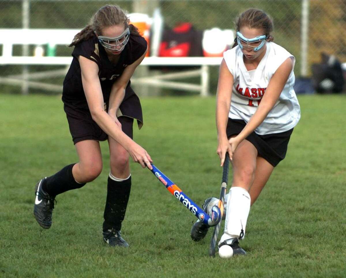 Masuk's #18 Natalie Ciancetta, right, tries to block an advance by Barlow's #16 Anne Dolan, during game action in Monroe, Conn. on Tuesday Oct. 06, 2009.
