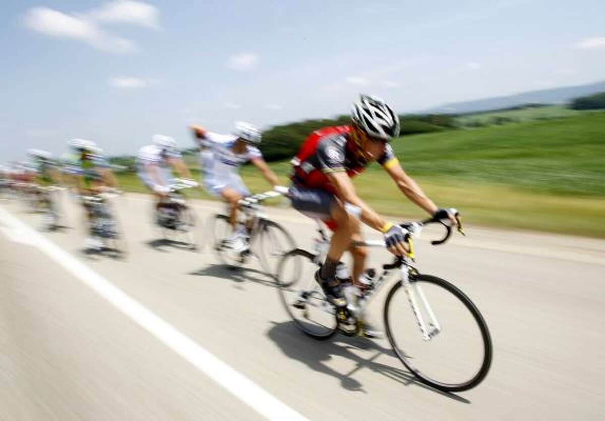 Seven-time champion Lance Armstrong, right, rides in the pack during the seventh stage of the Tour de France.