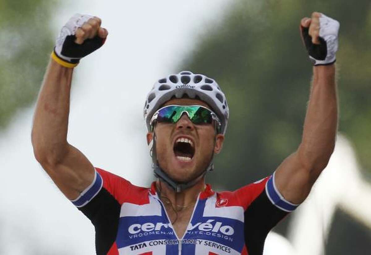 Thor Hushovd of Norway crosses the finish line to win the third stage.