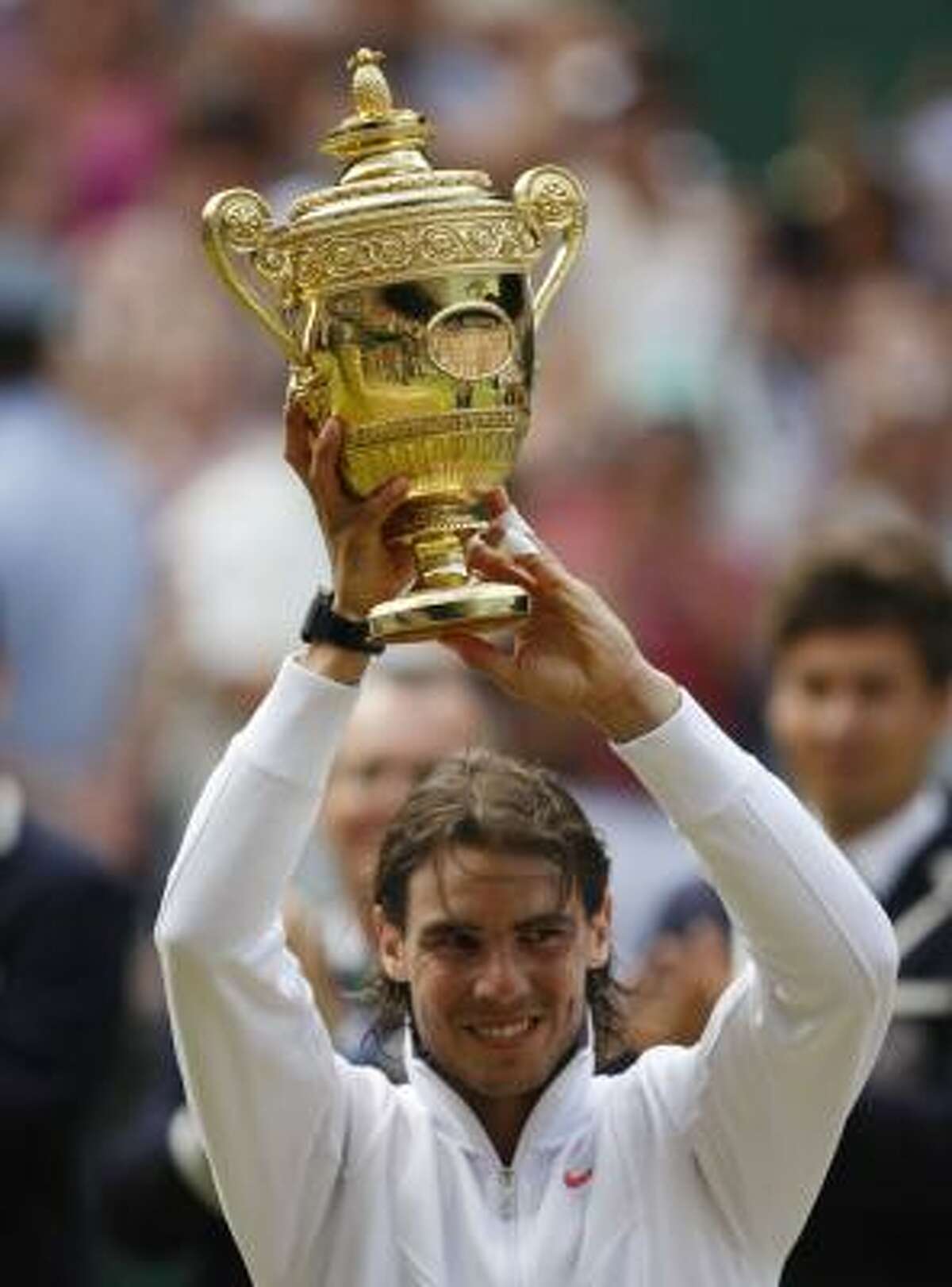 Rafael Nadal shows off his trophy.