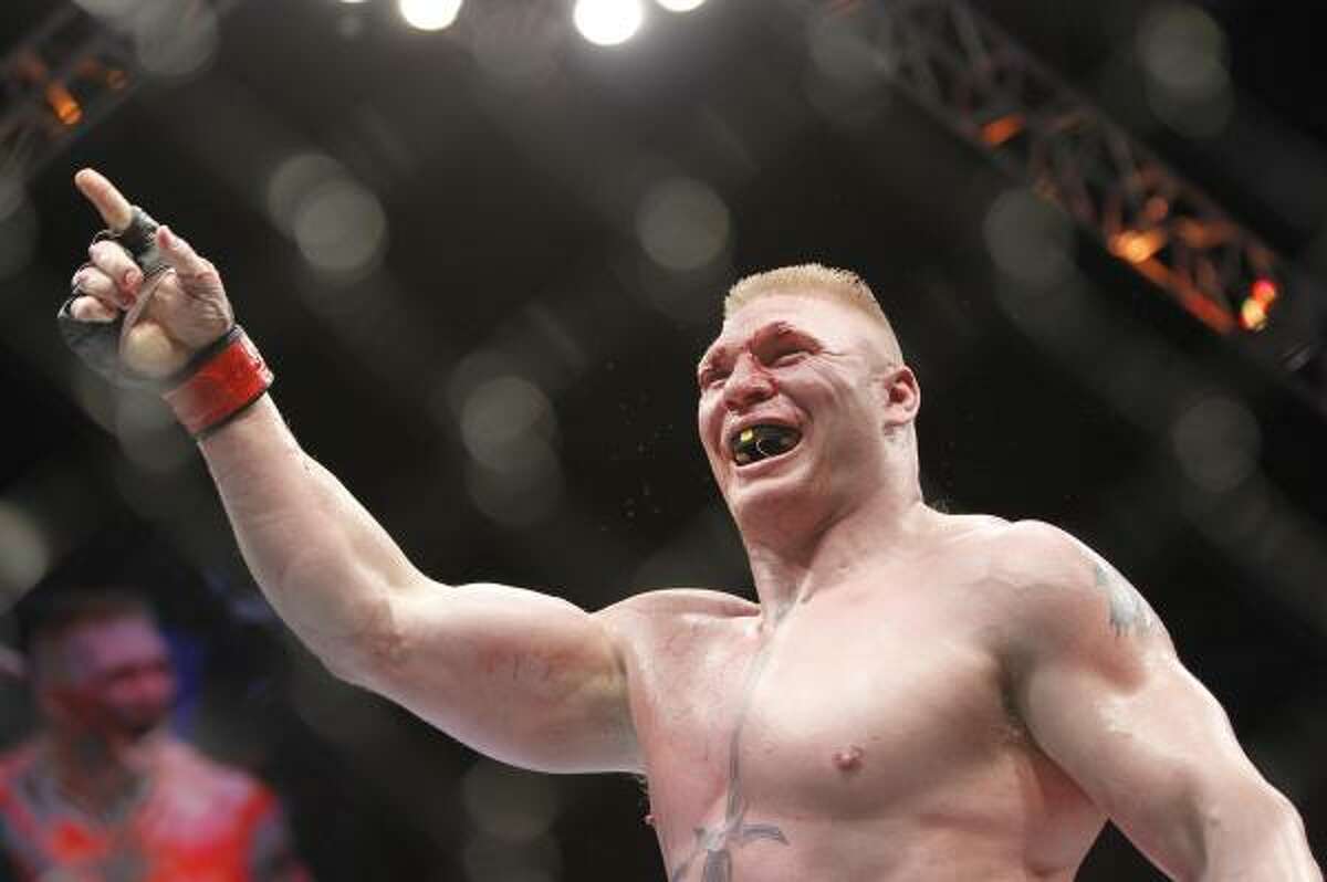 Brock Lesnar celebrates his victory over Shane Carwin during their UFC heavyweight title match.