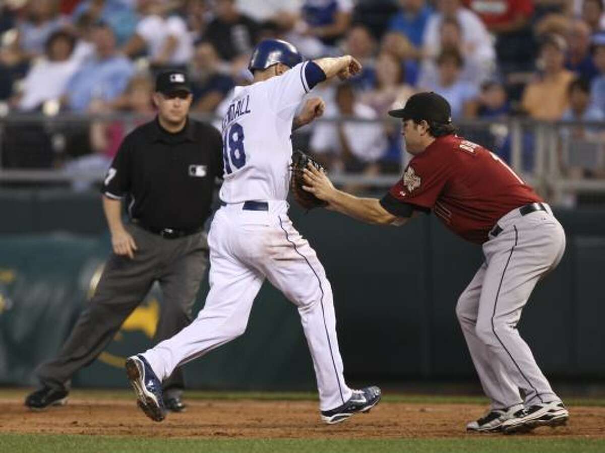 Royals' Jason Kendall is caught stealing second in a run down by Astros first baseman Lance Berkman.