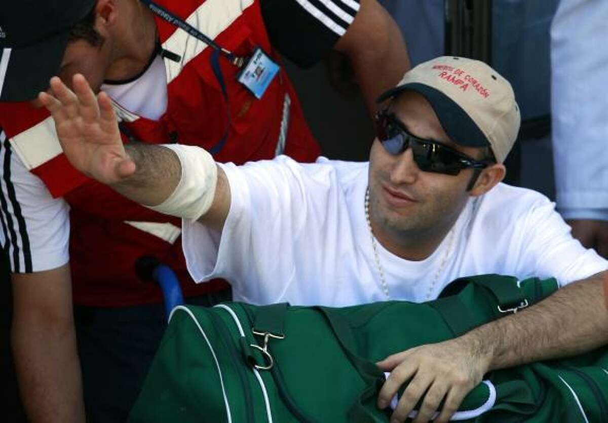 Rescued miner Carlos Barrios, 24, arrives at the hospital in Copiapo, Chile, sporting his pair of Oakley sunglasses.