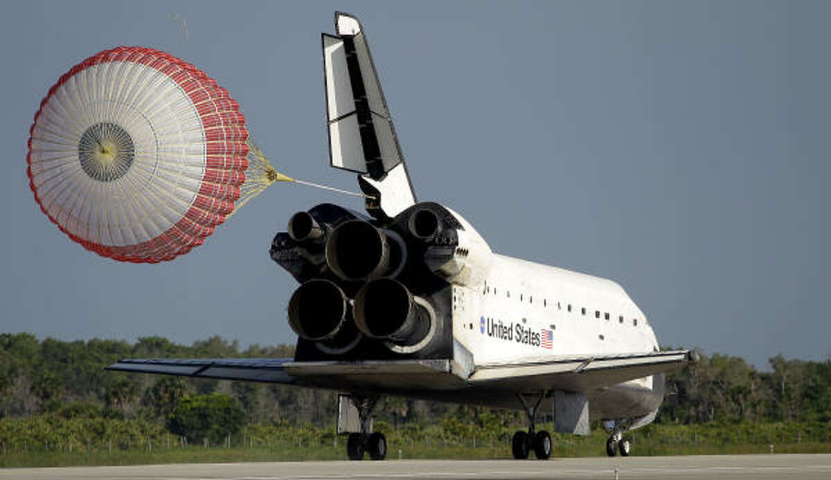 Astronauts on the space shuttle Atlantis deploy her braking parachute during landing on Kennedy Space Center's Runway 33 on May 26, 2010, in Cape Canaveral, Fla. Story: Shuttle Atlantis makes final landing after 120 million miles