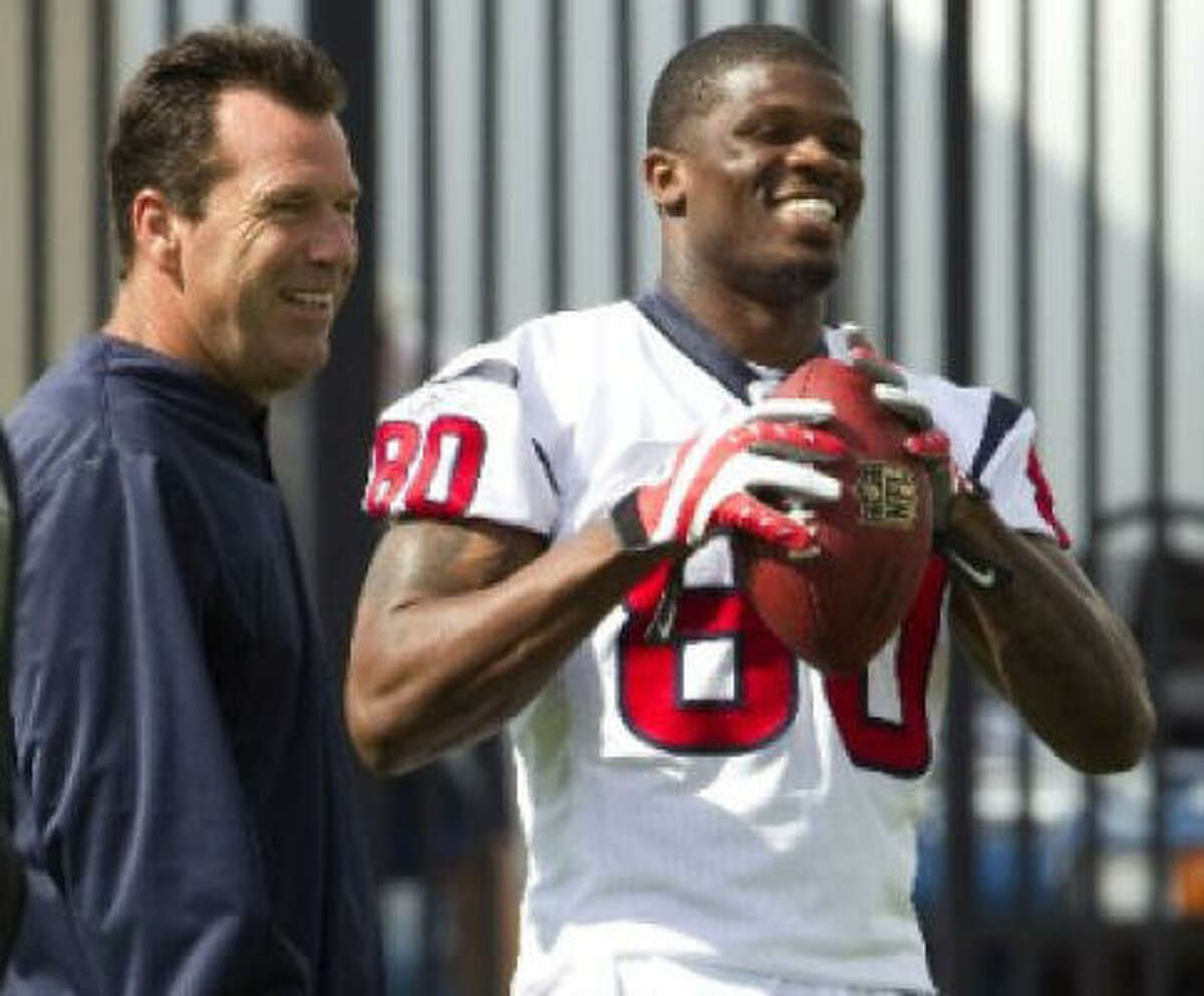 All-Pro wide receiver Andre Johnson reported for voluntary organized team activities Thursday after missing three days because he was unhappy with his contract.