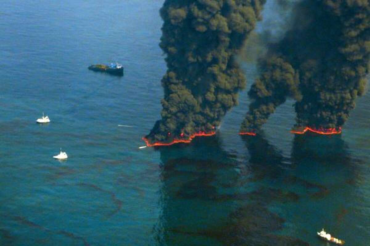 Crews conduct overflights of controlled burns taking place in the Gulf of Mexico to contain oil spewing from BP's Macondo well.