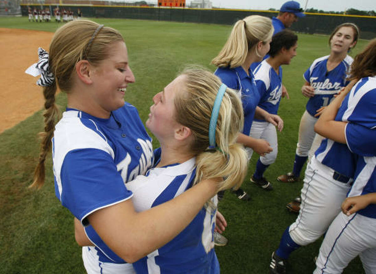 Katy Taylor pitcher Callie Lazarine, left, shares a moment with shortstop Aly Williams after the Mustangs beat Cinco Ranch 2-1 in Saturday's Region III-5A quarterfinals. Lazarine hit a ball off the left field fence that brought in Williams with the eventual game-winning run as Katy Taylor broke a 1-1 tie in the sixth inning.