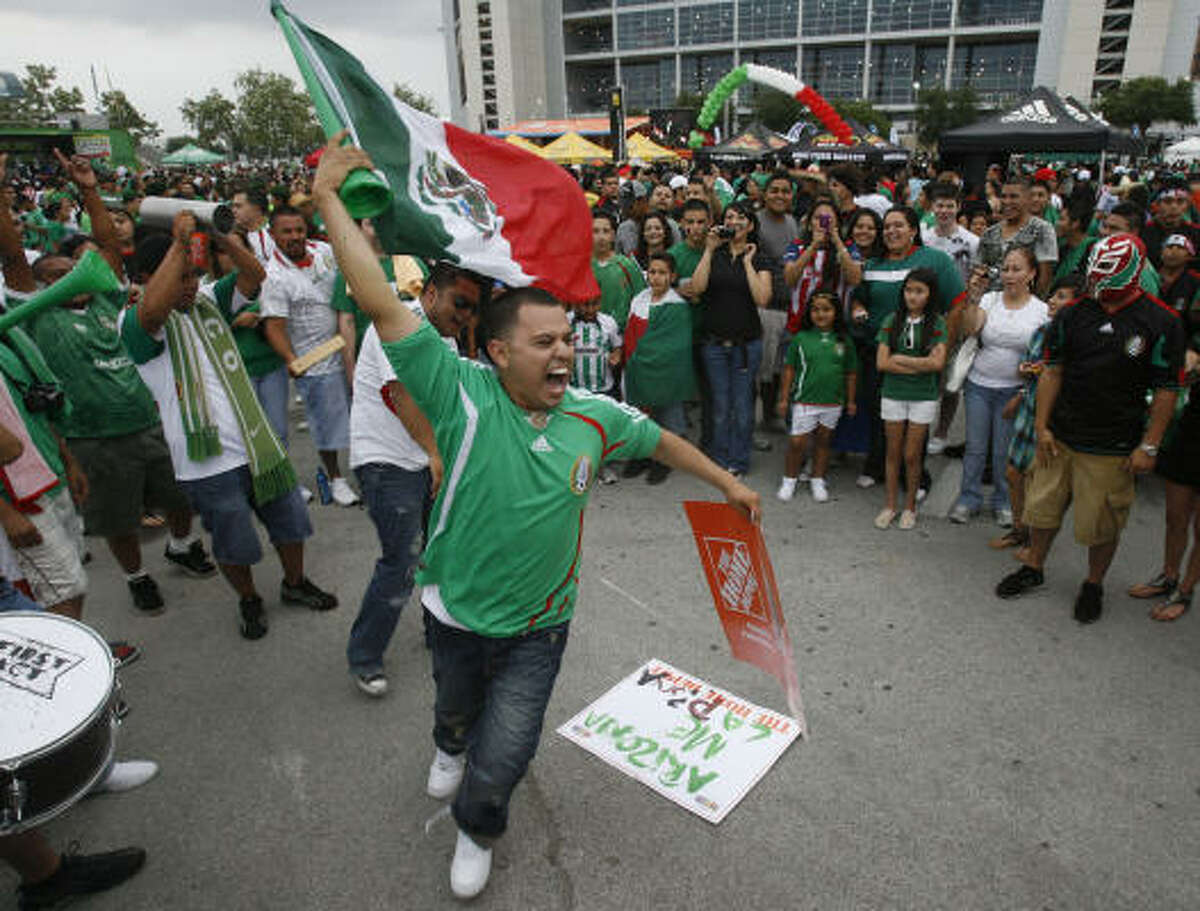 Cesar Garza, a Mexico national soccer team supporter from Houston, gets the crowd pumped prior to a pre-World Cup friendly game.
