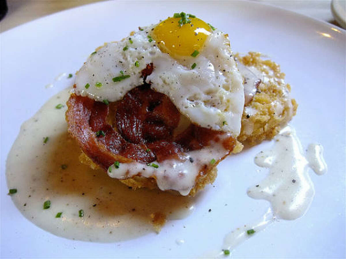 Fried green tomatoes with pancetta crisp, sunnyside quail egg and the lightest country "gravy," at Rainbow Lodge.