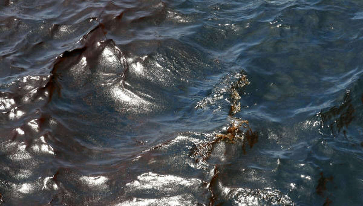 Oil is seen covering the water's surface while looking down from the bridge on the Joe Griffin at the site of the Deepwater Horizon oil spill in the Gulf of Mexico off the coast of Louisiana Monday, May 10, 2010.
